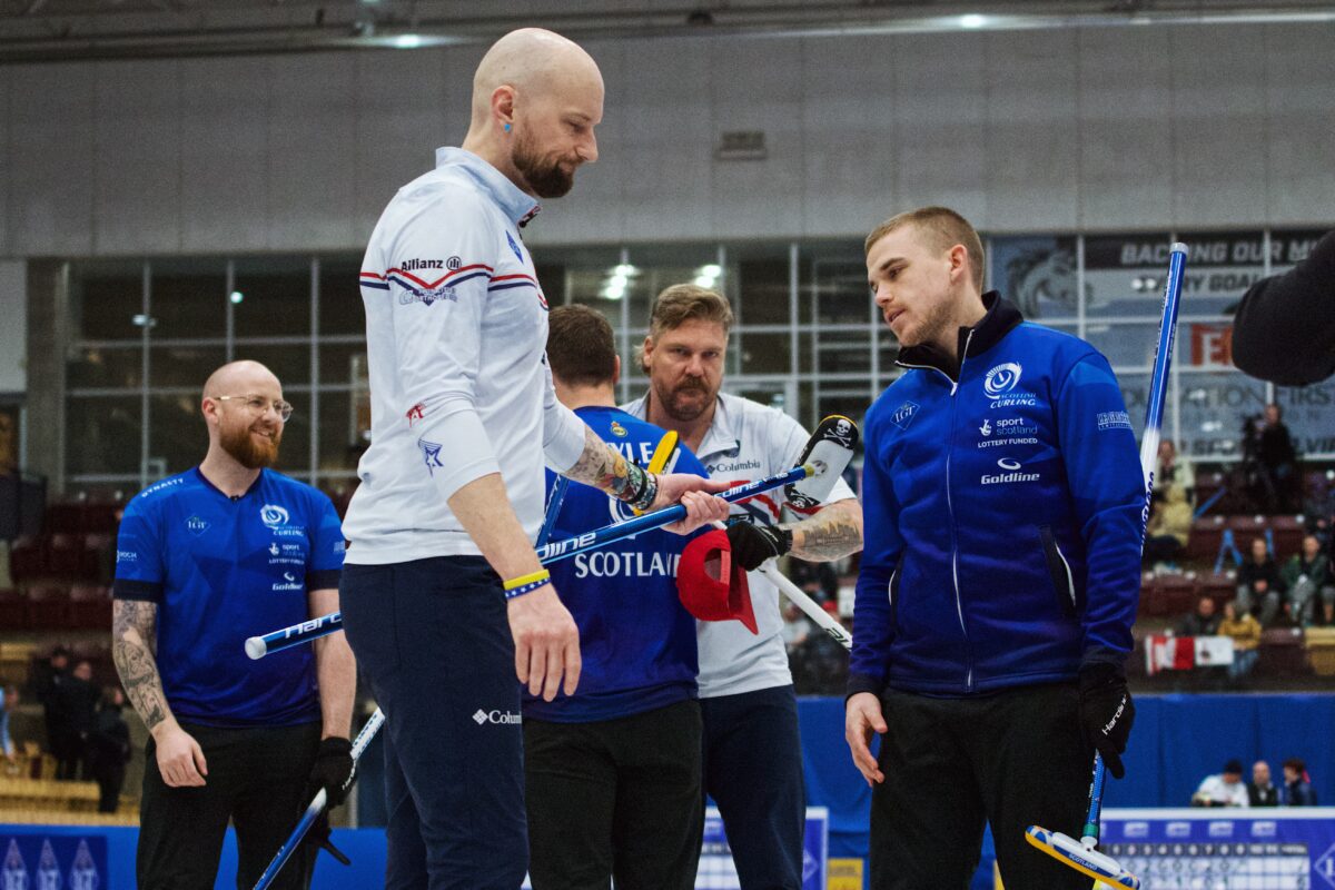 From the left, Scottish vice skip Robin Brydone, U.S. second Colin Hufman, Scottish lead Euan Kyle, U.S. lead Matt Hamilton and Scottish skip Ross Whyte exchange handshakes after Scotland won the bronze-medal game against the U.S. on Saturday, April 4, 2026, at the 2026 World Men's Curling Championship in Ogden, Utah.